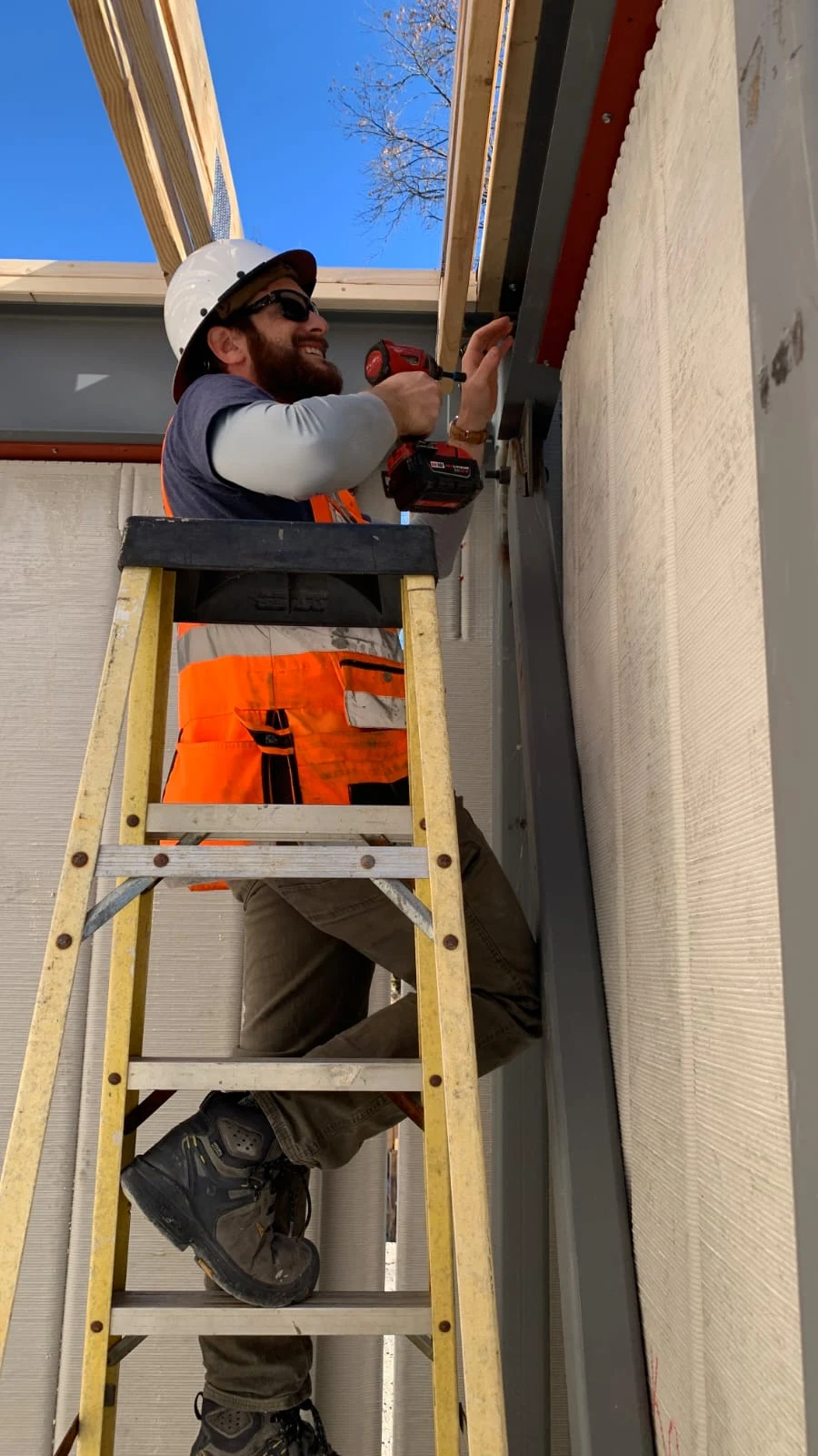 Amichai Becker working on a home repair project